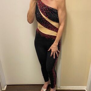One-Shoulder Black and Gold Jumpsuit with Red Accents
